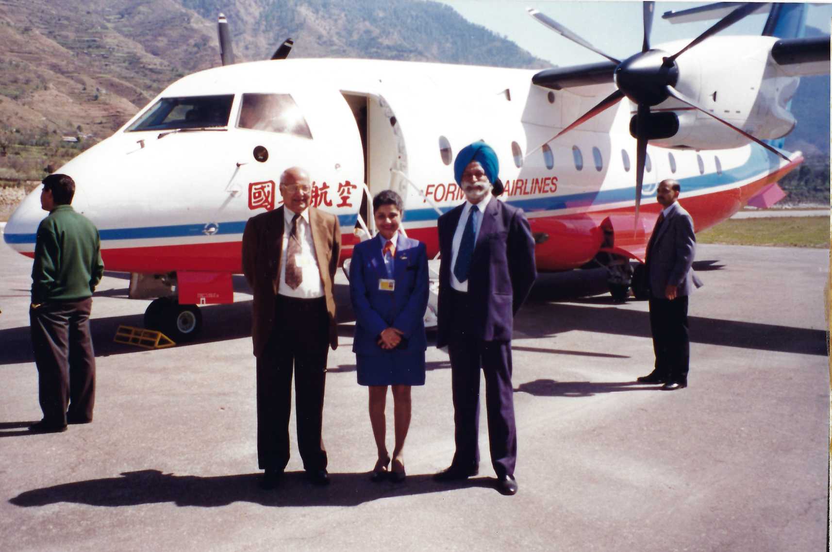 low Dornier 328-110 aircraft in Formosa Airline colours at 5000 ft above sea level.